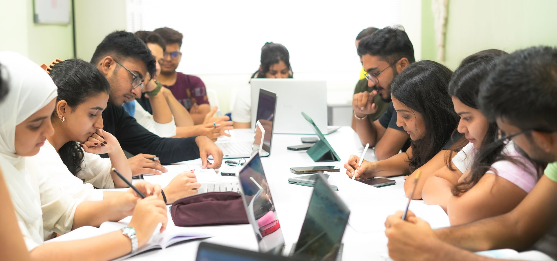 Students in a study session at Polly's CFA Classes